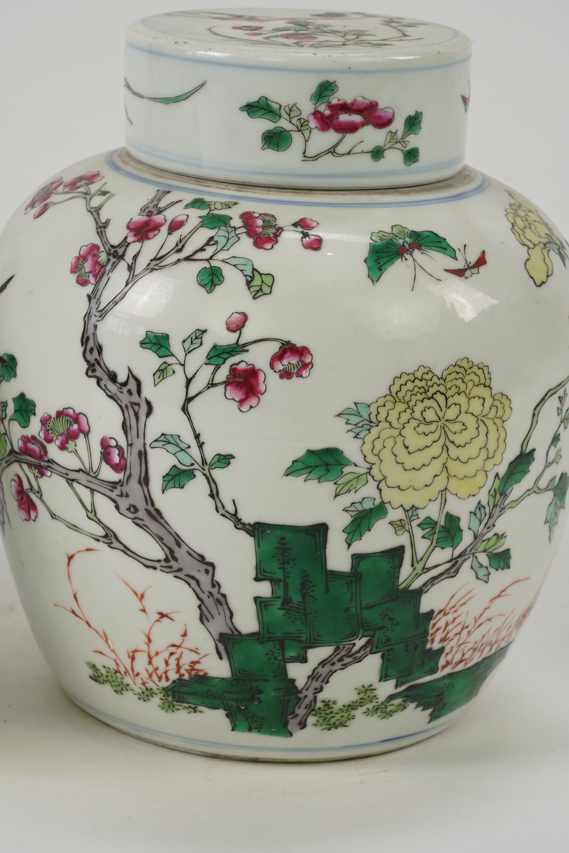 A pair of Chinese famille rose jars and covers, Kangxi mark but late 19th/early 20th century